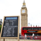 A chalkboard that says Oddschecker and has written in chalk the exit odds of Boris Johnson and also odds for Next Prime Minister, with a number of names listed. In the background is seen Big Ben and a double decker bus.
